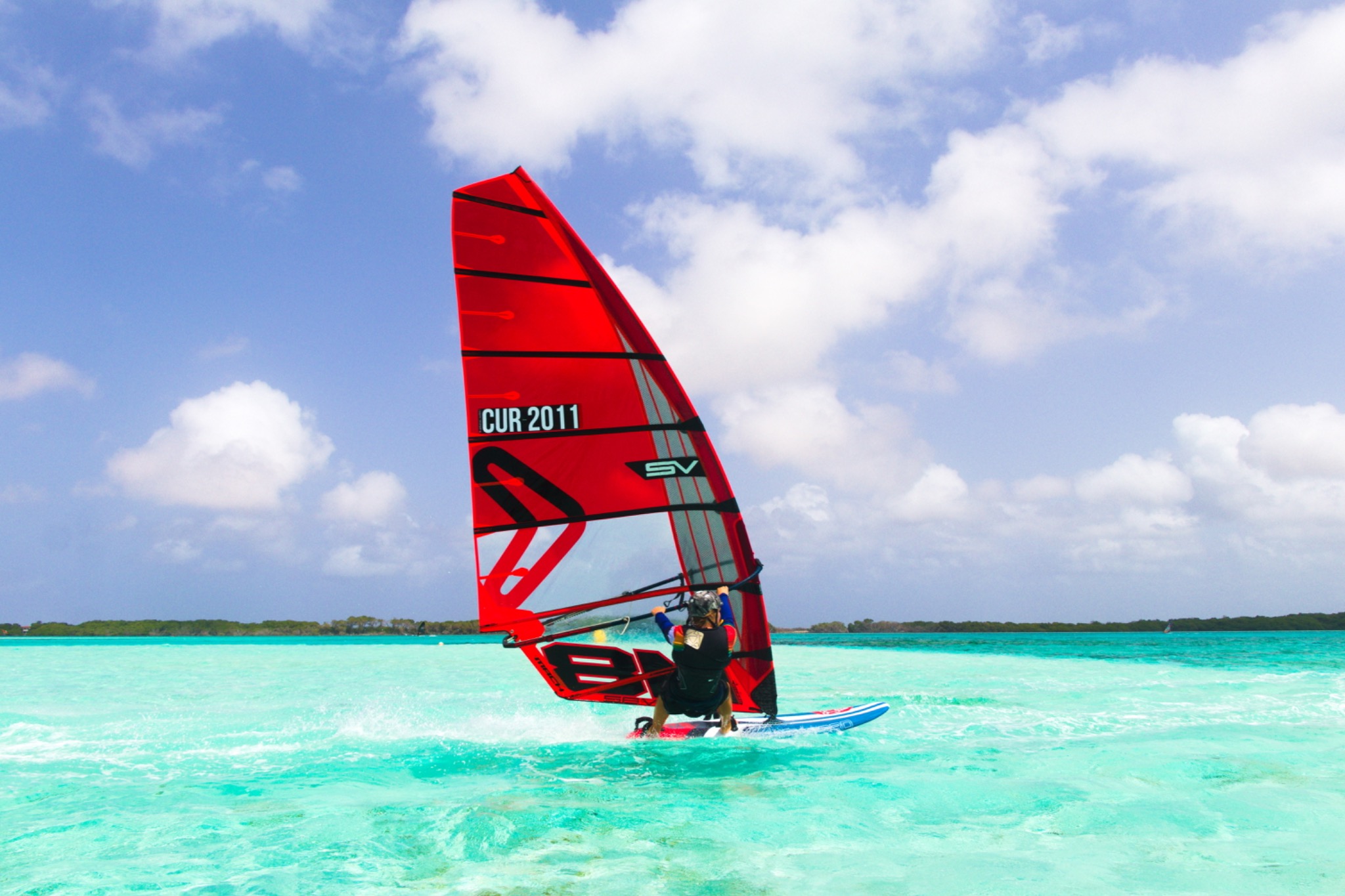Thomas Cur windsurfing with sail number CUR-2011